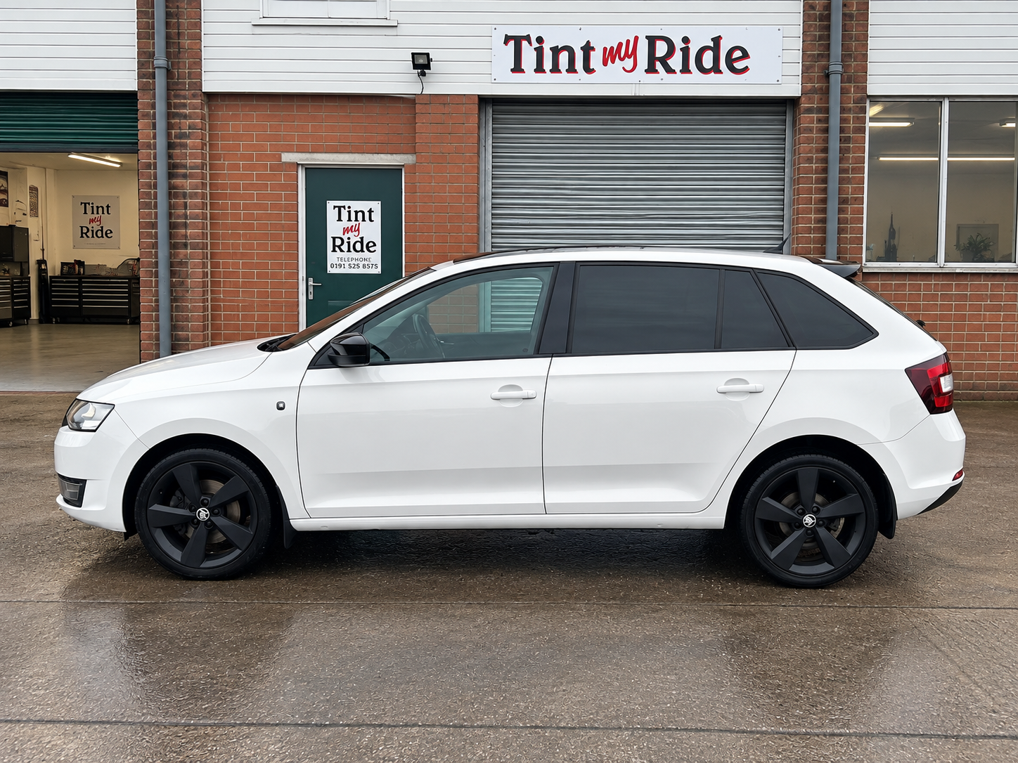 White estate with dark rear window tint