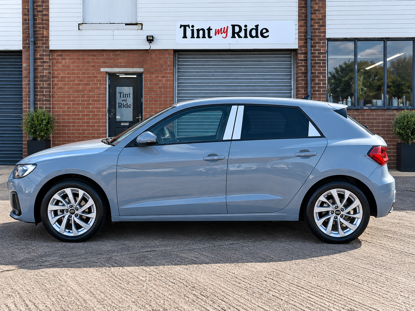 Grey Audi A1 with rear window tint